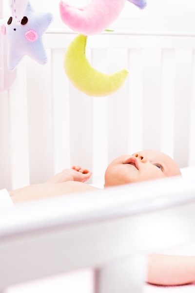 Photo of baby in a cot